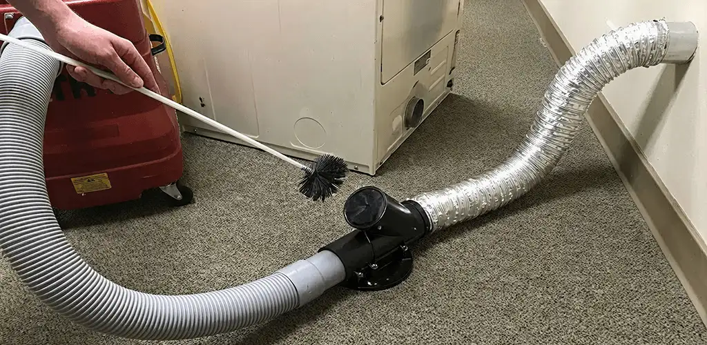 Dryer vent cleaning service removing lint from a dryer duct connection in Fort Worth, TX