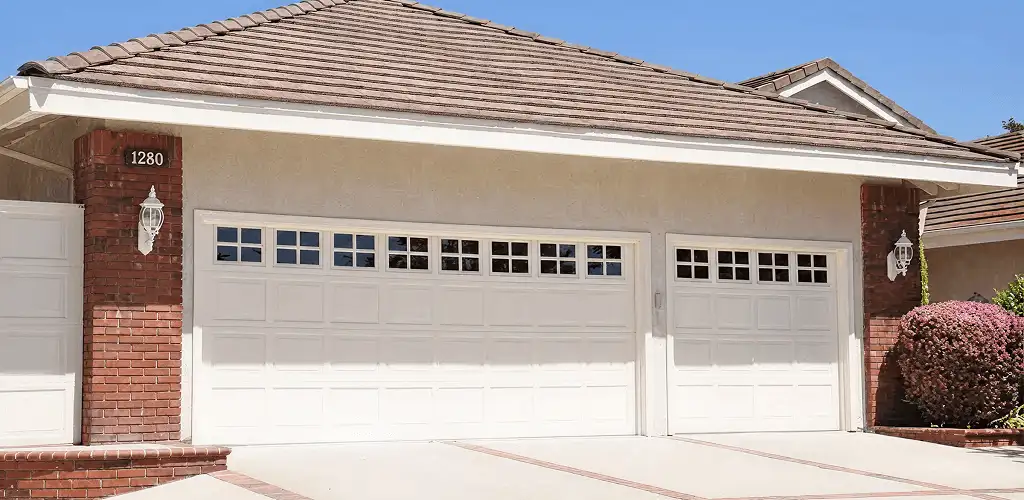 Residential garage door repair service for a double garage door in Fort Worth, TX