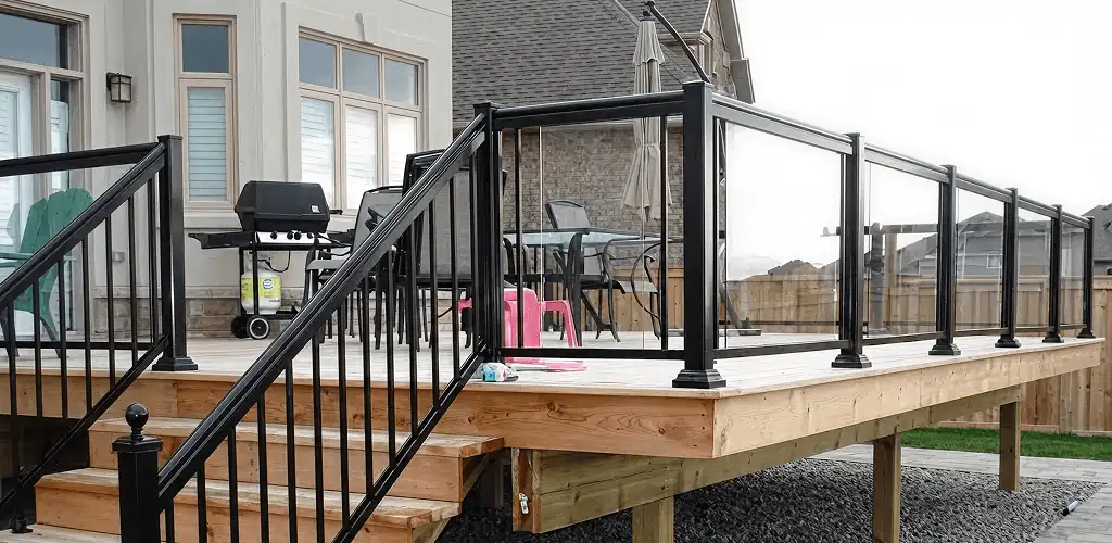Handrail installation on a deck staircase for safety and code compliance in Fort Worth, TX