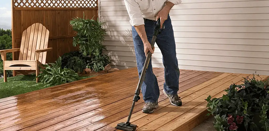 Deck staining service applying stain to a backyard wood deck in Fort Worth, TX